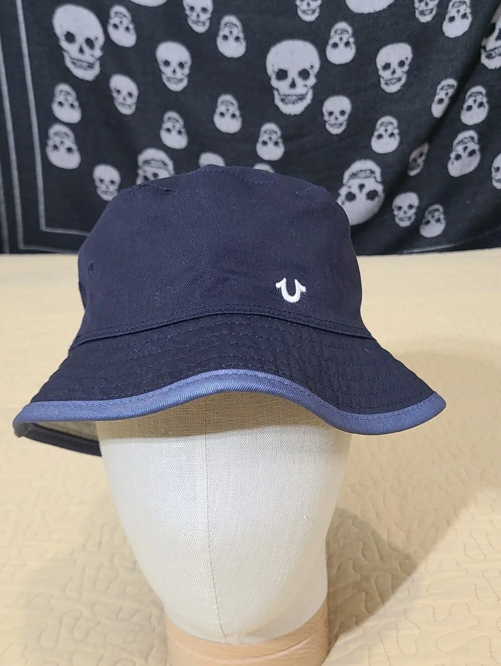 True Religion reversible embroidered logo bucket hat.